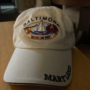 Baltimore Maryland cap beige in color. The emblem state “The Old Line State”